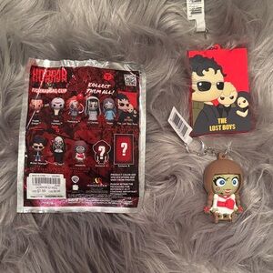 Spirit Halloween The Lost Boys & Annabelle bag clips
